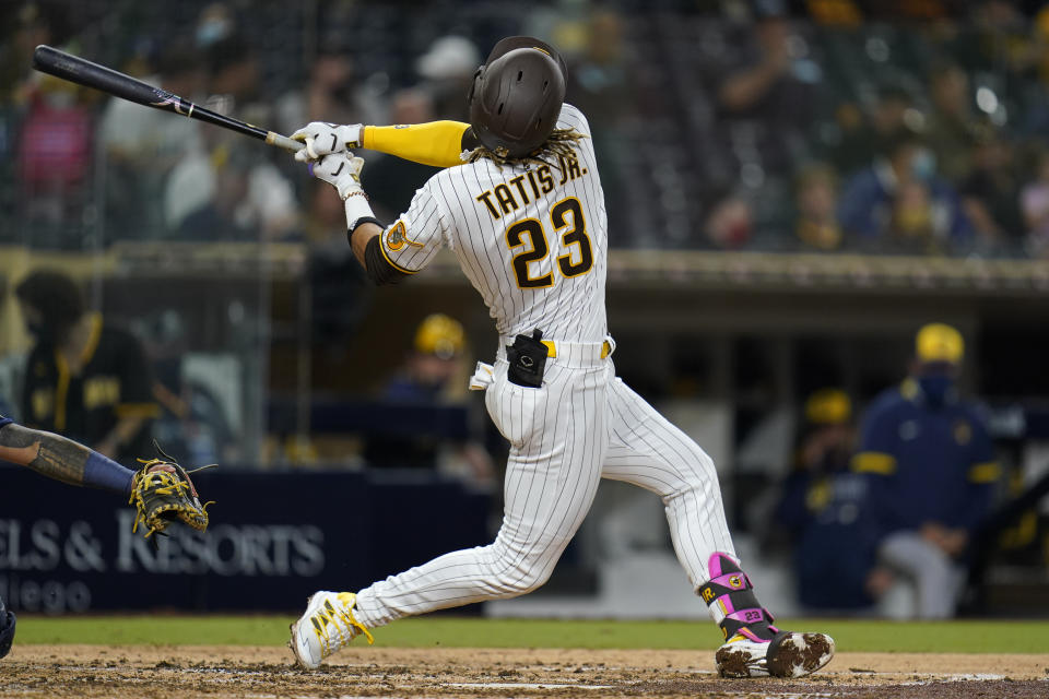 San Diego Padres' Fernando Tatis Jr. swings while batting during the sixth inning of a baseball game against the Milwaukee Brewers, Monday, April 19, 2021, in San Diego. (AP Photo/Gregory Bull)