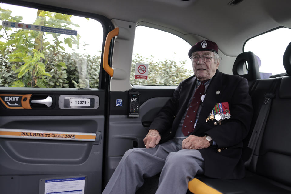 British veteran Bill Gladen arrives in a British Taxi Charity for Military Veterans to the ceremony at Pegasus Bridge, in Ranville, Normandy, Sunday, June, 5, 2022. On Monday, the Normandy American Cemetery and Memorial, home to the gravesites of 9,386 who died fighting on D-Day and in the operations that followed, will host U.S. veterans and thousands of visitors in its first major public ceremony since 2019. (AP Photo/Jeremias Gonzalez)