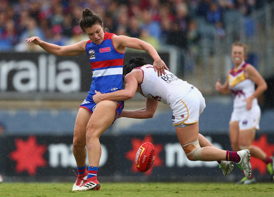 Ellie Blackburn of the Bulldogs is tackled by Leah Kaslar of the Lions during the AFLW 2018 Grand Final. Pic: Getty