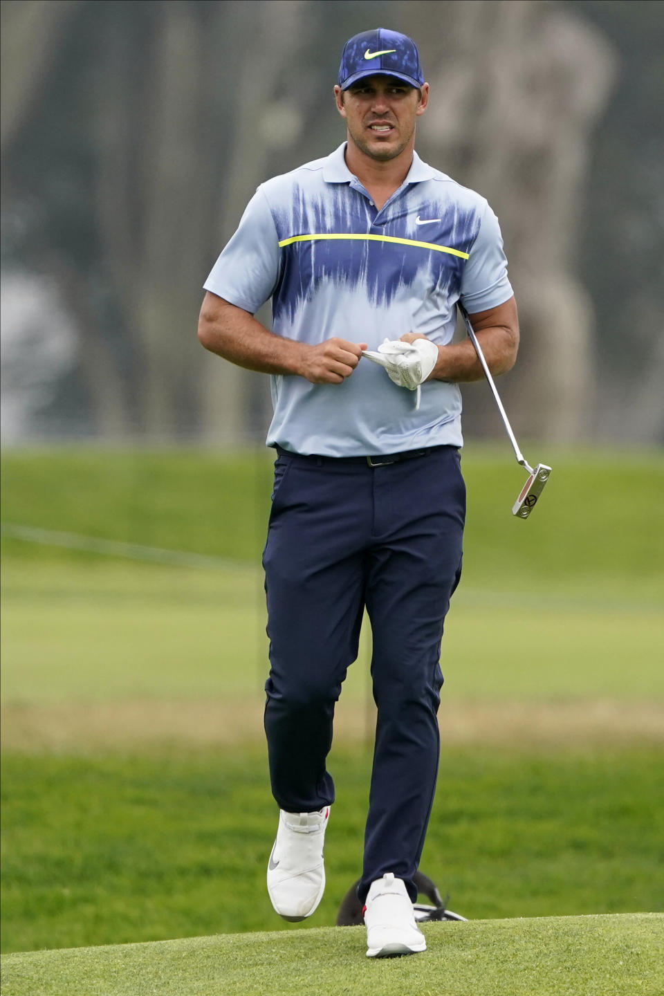 Brooks Koepka walks to the green on the ninth hole during the final round of the PGA Championship golf tournament at TPC Harding Park Sunday, Aug. 9, 2020, in San Francisco. (AP Photo/Charlie Riedel)