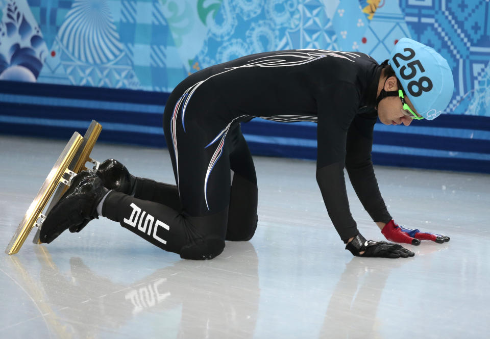 J.R. Celski of the United States crashes out in a men's 1000m short track speedskating quarterfinal at the Iceberg Skating Palace during the 2014 Winter Olympics, Saturday, Feb. 15, 2014, in Sochi, Russia. (AP Photo/Ivan Sekretarev)