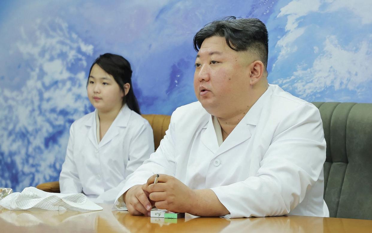 Kim Jong Un and daughter Kim Ju Ae inspect North Korea's first military reconnaissance satellite - AFP