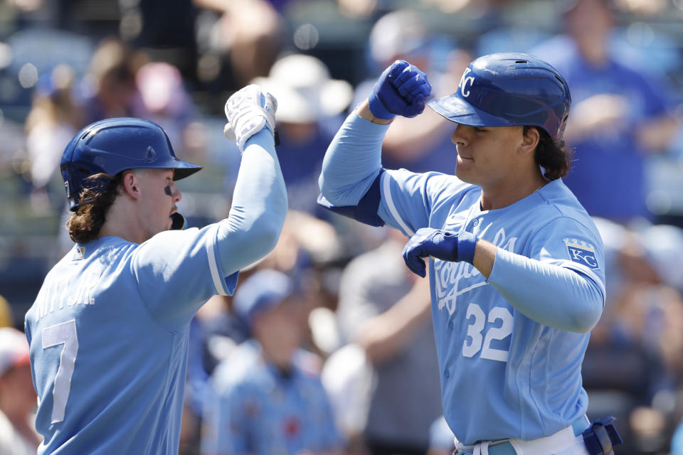 Kansas City Royals Nick Pratto (32) is congratulated by Bobby Witt Jr. (7) at home plate after hitting a home run during the first inning of a baseball game against the Colorado Rockies in Kansas City, Mo., Saturday, June 3, 2023. (AP Photo/Colin E. Braley)