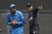 India's captain Rohit Sharma and New Zealand's captain Kane Williamson talk at the coin toss during the ICC Men's Cricket World Cup first semifinal match between India and New Zealand in Mumbai, India, Wednesday, Nov. 15, 2023. (AP Photo/Rafiq Maqbool)