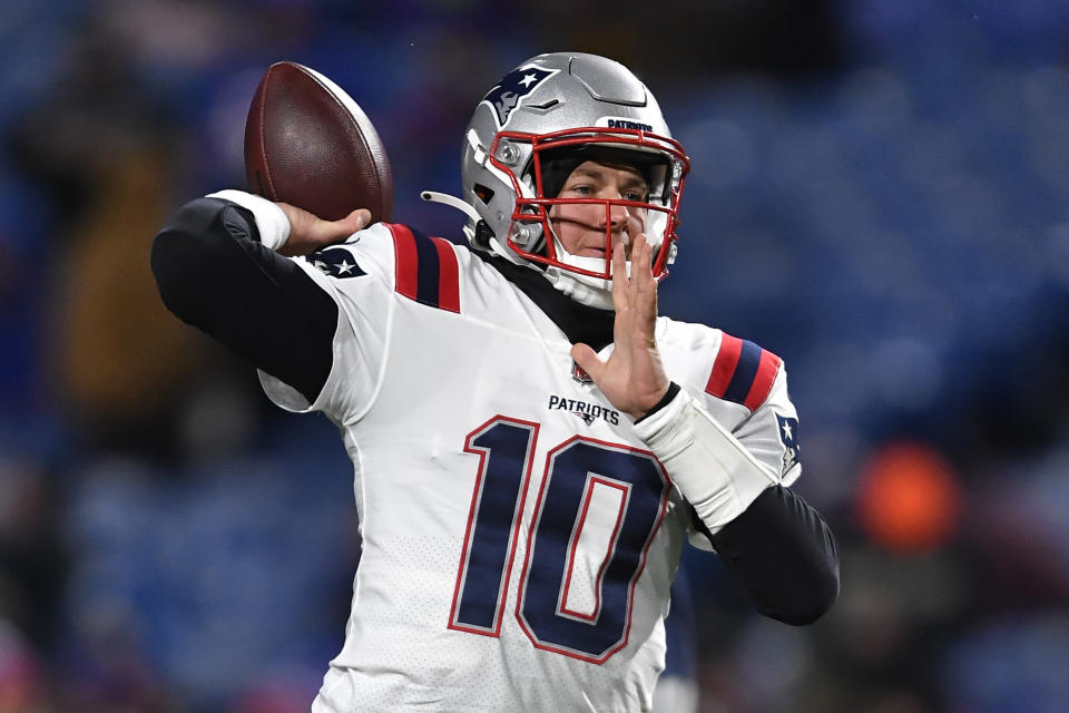 New England Patriots quarterback Mac Jones (10) looks to throw a pass during the first half of an NFL football game against the Buffalo Bills in Orchard Park, N.Y., Monday, Dec. 6, 2021. (AP Photo/Adrian Kraus)