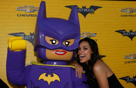 Cast member Rosario Dawson poses with a Lego character at the premiere of the movie "The LEGO Batman Movie" in Los Angeles, California, U.S., February 4, 2017. REUTERS/Mario Anzuoni