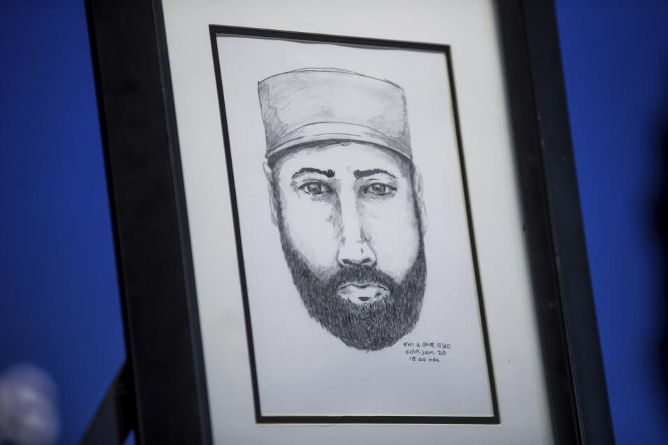 A sketch of a man who the Royal Canadian Mounted Police say interacted with Lucas Fowler and Chynna Deese is displayed during a news conference, in Surrey, British Columbia, on Monday July 22, 2019.  Lucas, a 23-year-old Australian who, along with his girlfriend Chynna Deese, 24, of Charlotte, N.C., were found dead in Northern British Columbia last week.  (Darryl Dyck/The Canadian Press via AP)