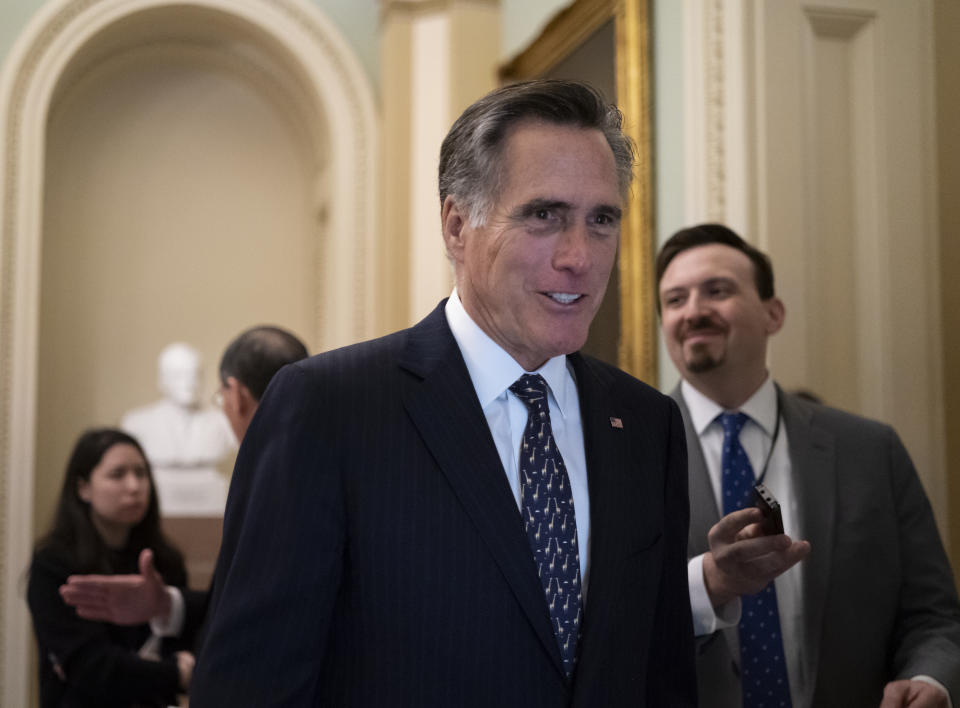 Sen. Mitt Romney, R-Utah, arrives at the Senate for a Republican lunch before work resumes in the impeachment trial of President Donald Trump on charges of abuse of power and obstruction of Congress, in Washington, Friday, Jan. 24, 2020. (AP Photo/J. Scott Applewhite)