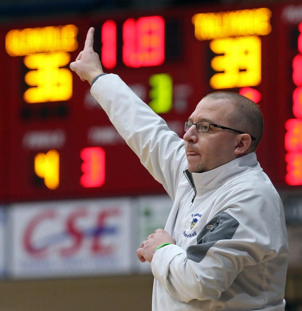 Former Tallmadge basketball coach Bill Johnson gestures on the sideline during a Division II district semifinal game in Canton March 4. Johnson resigned as basketball coach last month to focus on his job as Tallmadge athletic director.