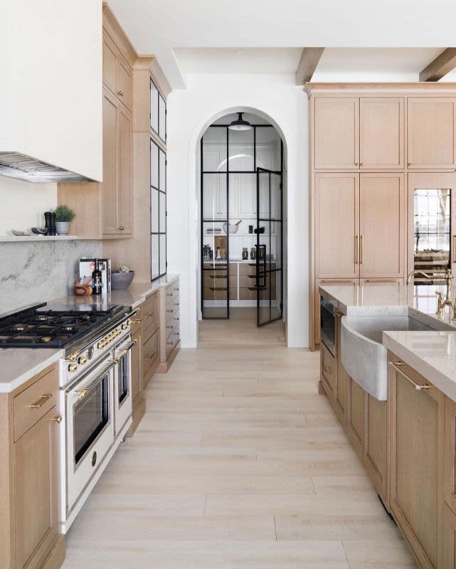 A pantry is transformed into a back kitchen in this high-end home.<p>Bertazzoni, Courtesy of Designers SmithErickson Designs, Inc., Photographer Michelle Johnson</p>