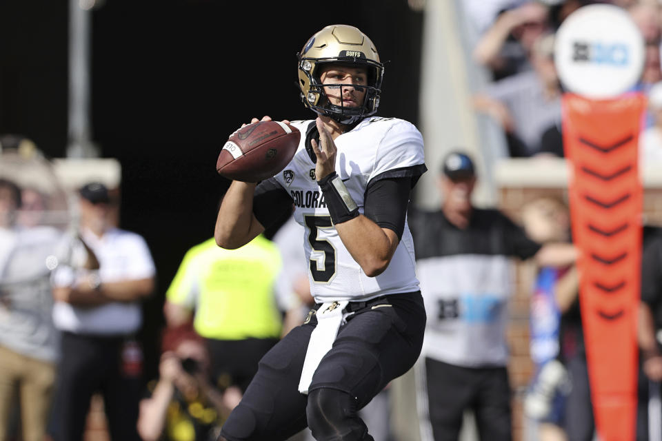 Colorado quarterback J.T. Shrout (5) looks to throw against Minnesota during the first half of an NCAA college football game, Saturday, Sept. 17, 2022, in Minneapolis. (AP Photo/Stacy Bengs)