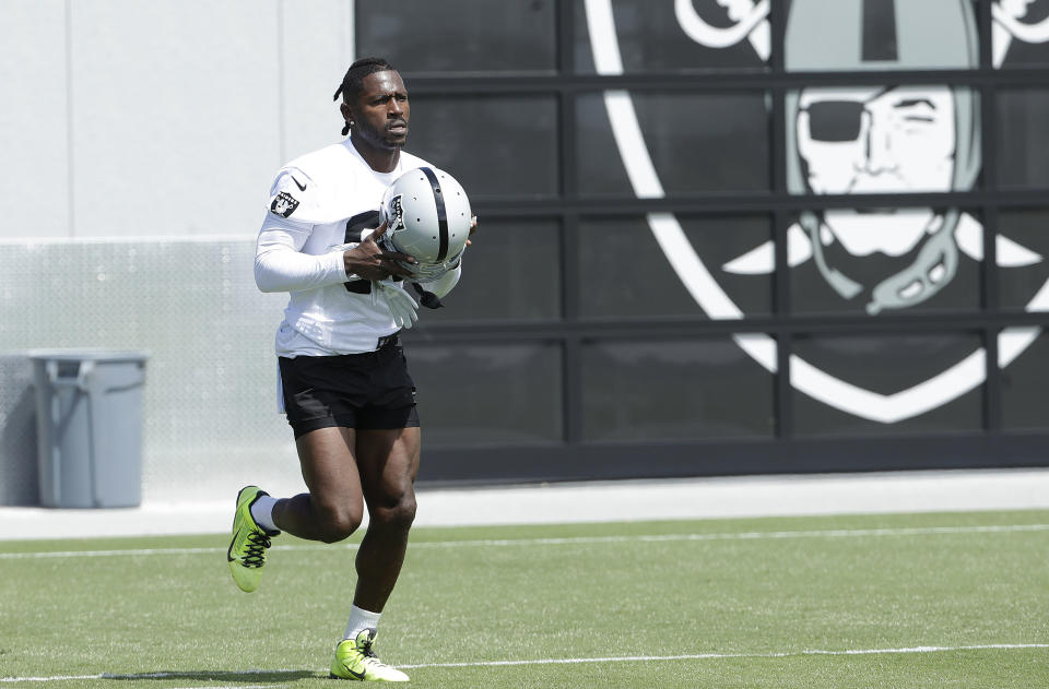 Oakland Raiders wide receiver Antonio Brown warms up during an official team activity at their headquarters in Alameda, Calif. in May.