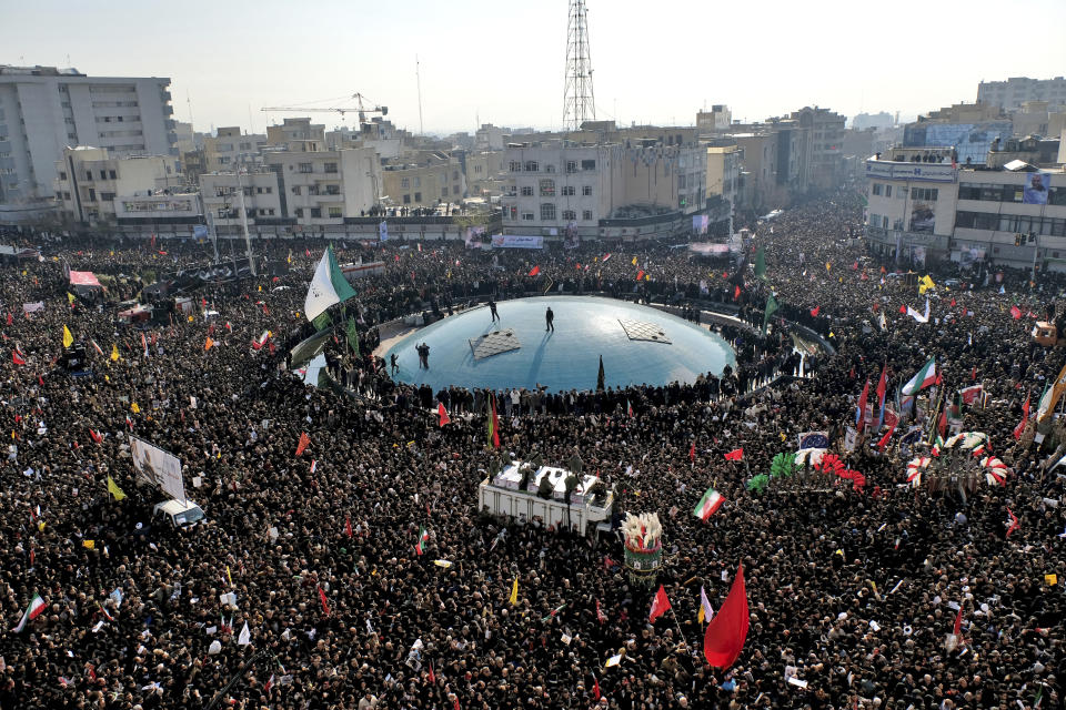 Coffins of Gen. Qassem Soleimani and others who were killed in Iraq by a U.S. drone strike, are carried on a truck surrounded by mourners during a funeral procession at the Enqelab-e-Eslami (Islamic Revolution) square in Tehran, Iran, Monday, Jan. 6, 2020. The processions mark the first time Iran honored a single man with a multi-city ceremony. Not even Ayatollah Ruhollah Khomeini, who founded the Islamic Republic, received such a processional with his death in 1989. Soleimani on Monday will lie in state at Tehran's famed Musalla mosque as the revolutionary leader did before him. (AP Photo/Ebrahim Noroozi)