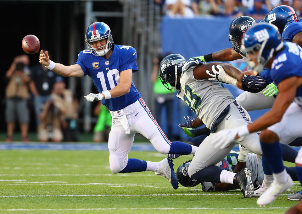 <p>Quarterback Eli Manning #10 of the New York Giants throws a pass against the Seattle Seahawks during the first quarter of the game at MetLife Stadium on October 22, 2017 in East Rutherford, New Jersey. (Photo by Al Bello/Getty Images) </p>