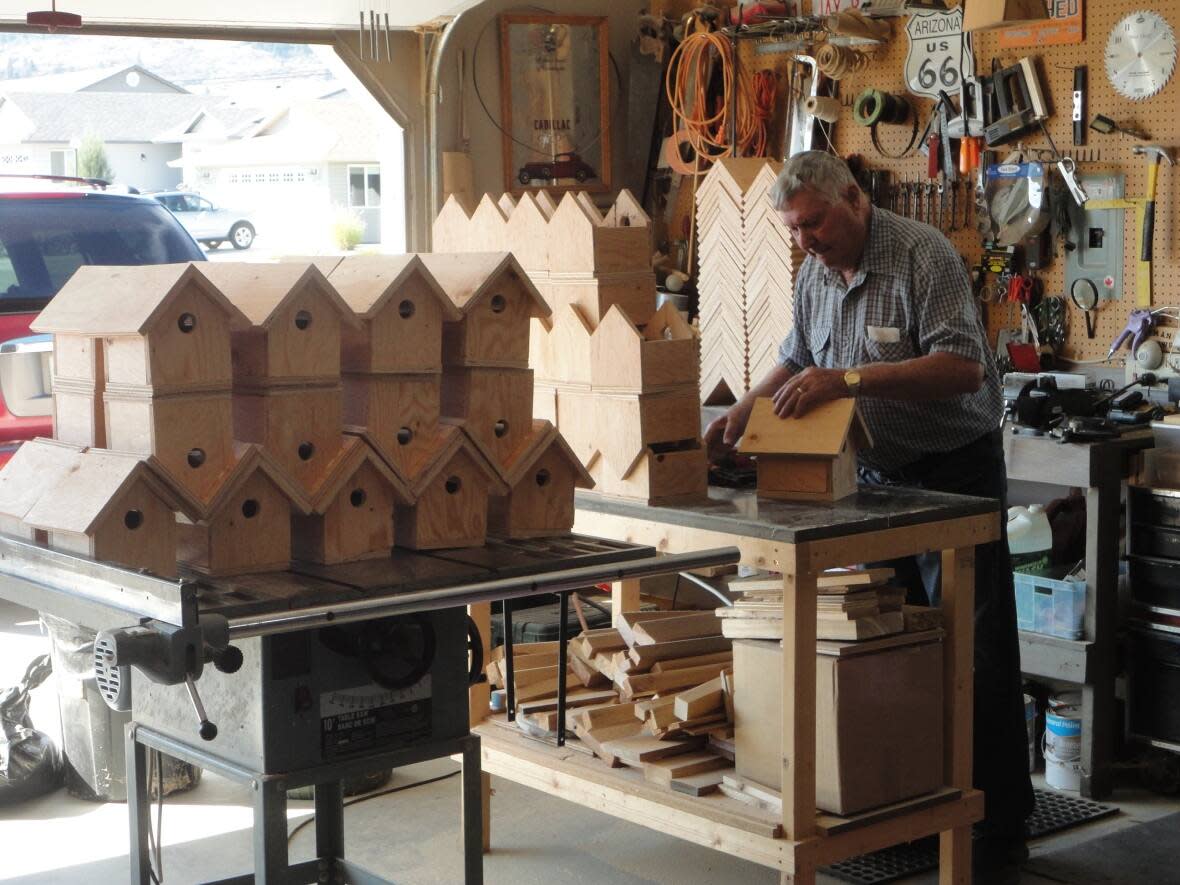John Remple is pictured making wooden birdhouses in his garage in Vernon, B.C. He has won this year’s B.C. Principals’ and Vice-Principals’ Association Partnership Award for his voluntary service. (Submitted by Joyce Remple - image credit)