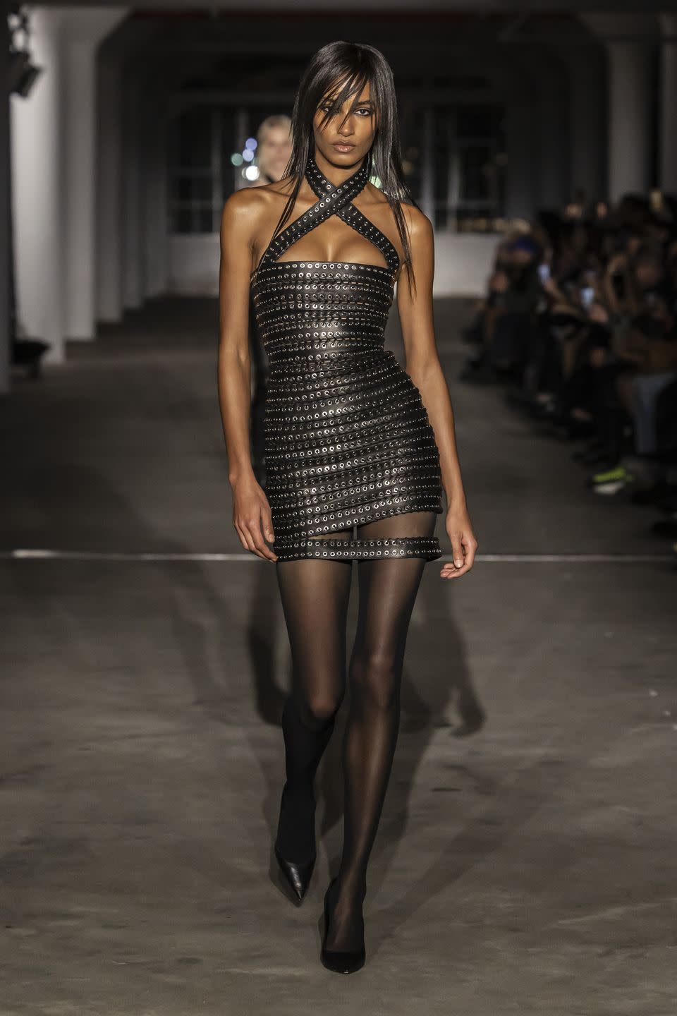 a woman walking on a runway