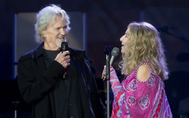 <p>Dave J Hogan/Getty</p> Barbra Streisand performs with Kris Kristofferson in 2019.