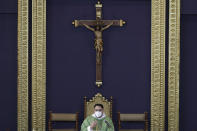 Catholic priest Fr. Ian Espartero gestures as he officiates mass with a few parishioners as a measure to prevent the spread of COVID19 at the Our Lady of Consolation Parish on Sunday, Aug. 2, 2020, in Quezon city, Philippines. Coronavirus infections in the Philippines continues to surge Sunday as medical groups declared the country was waging a losing battle against the contagion and asked the president to reimpose a lockdown in the capital. (AP Photo/Aaron Favila)