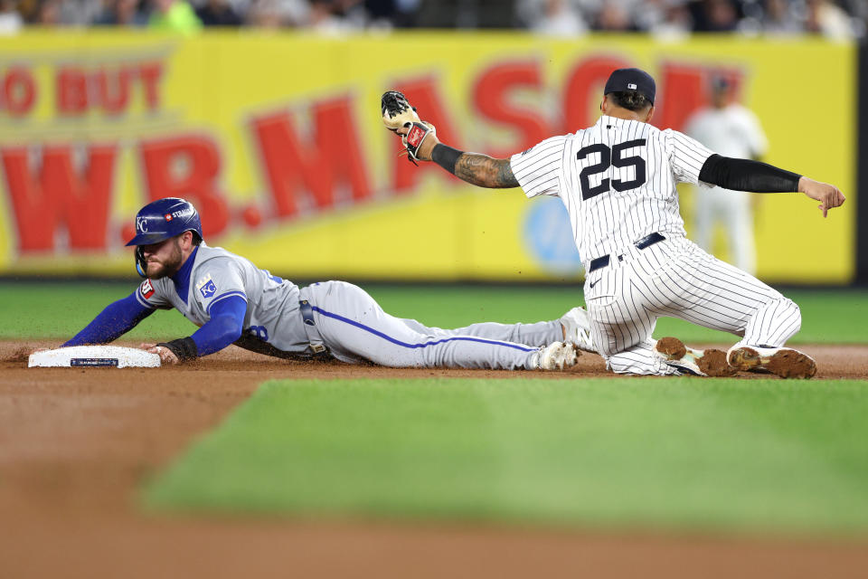 NEW YORK, NEW YORK - OCTOBER 07: Gleyber Torres #25 of the New York Yankees tags out Kyle Isbel #28 of the Kansas City Royals attempting to steal second base in the seventh inning during Game Two of the Division Series at Yankee Stadium on October 07, 2024 in New York City. (Photo by Elsa/Getty Images)