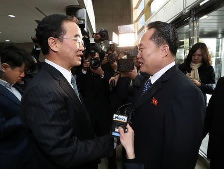 Head of the North Korean delegation Ri Son Gwon shakes hands with his South Korean counterpart Cho Myoung-gyon before their meeting at the truce village of Panmunjom in the demilitarised zone separating the two Koreas, South Korea, January 9, 2018. Yonhap via REUTERS