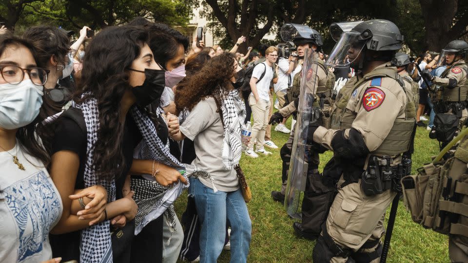 Demonstrators and Texas state troopers stand off during a pro-Palestinian protest at the University of Texas in Austin on Wednesday. - Jordan Vonderhaar/Bloomberg via Getty Images