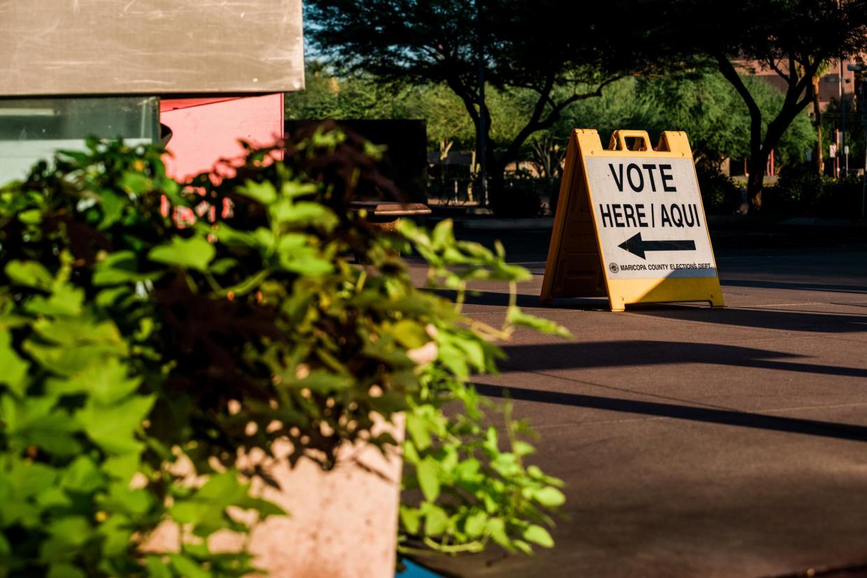 <span>A "vote here" sign outside a polling location in Phoenix, Arizona, on 2 August 2022.</span><span>Photograph: Caitlin O'Hara/Bloomberg via Getty Images</span>
