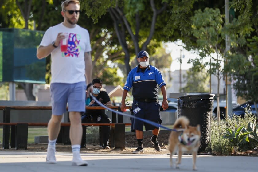 A West Hollywood security ambassador patrols West Hollywood Park