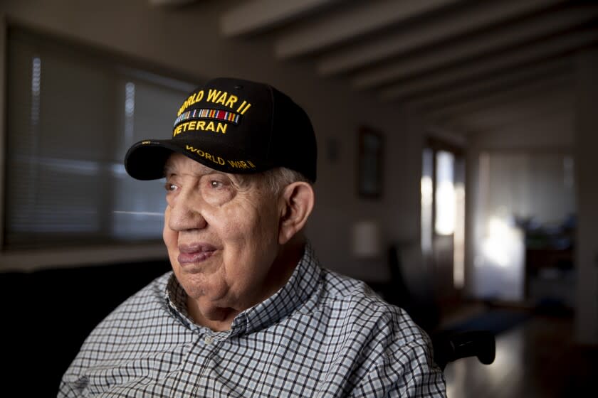 Los Angeles, CA - February 03: Bernard Benedict James, shown at his La Mirada home, will celebrate his 101st birthday later this month. He celebrated his last birthday over Zoom with his family. This year, he's not hoping for a big shindig, but he'd like to host some family at his home in La Mirada. Photo taken in on Thursday, Feb. 3, 2022 in Los Angeles, CA. Bernard Benedict James has no problem with telling people he was court martialed while serving with the segregated U.S. Army in Italy during World War II. He graduated from the University of Michigan with a degree in mathematics and went on to work for the aerospace industry, where he helped design ballistic missiles and several space craft.James was born in the south, court martialed in Italy, sent to prison for nearly two years and then sent back to Europe to finish out his service. (Allen J. Schaben / Los Angeles Times)