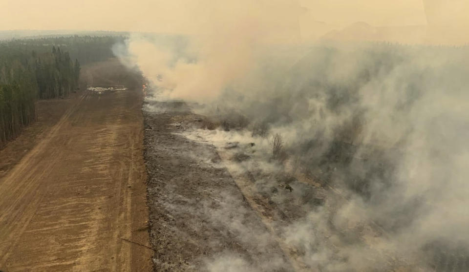 FILE - In this photo provided by the Government of Alberta Fire Service, a burned section of forest in the area near Edson, Alberta, smolders, Saturday, May 6, 2023. An early May heat wave this weekend could surpass daily records in parts of the Pacific Northwest. The National Weather Service has issued an excessive heat warning for much of the western parts of both Oregon and Washington. (Government of Alberta Fire Service/The Canadian Press via AP,File)