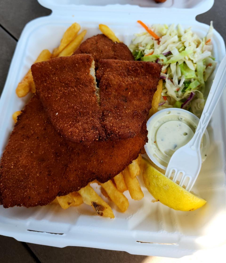 Monahan's Fish and Chips features wonderful flounder served with French fries and cole slaw.