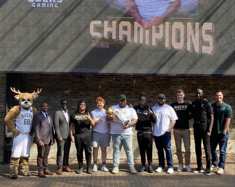 Bucks Gaming, who won the 2022 NBA 2K League championship, celebrates with Milwaukee Mayor Cavalier Johnson, Milwaukee County Executive David Crowley and Michael Belot, Bucks senior vice president of Bucks ventures and development, on Aug. 30 at The Beer Garden in Deer District.