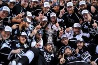 Jun 13, 2014; Los Angeles, CA, USA; Los Angeles Kings players pose for a team photo with the Stanley Cup after defeating the New York Rangers game five of the 2014 Stanley Cup Final at Staples Center. Mandatory Credit: Gary A. Vasquez-USA TODAY Sports