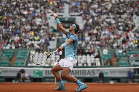 Tennis - French Open - Roland Garros - Rafael Nadal of Spain vs Sam Groth of Australia - Paris, France - 24/05/16. Rafael Nadal of Spain serves. REUTERS/Gonzalo Fuentes