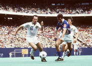 New York Cosmos Franz Beckenbauer (6) battles for the ball during an MLS soccer game, May 1, 1983 in East Rutherford, N.J. Beckenbauer followed in Pele’s footsteps by joining the New York Cosmos for four seasons beginning in 1977. (AP Photo)