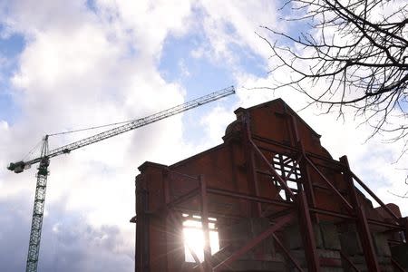 A crane towers over a building site, in Dublin, Ireland February 11, 2016. REUTERS/Clodagh Kilcoyne