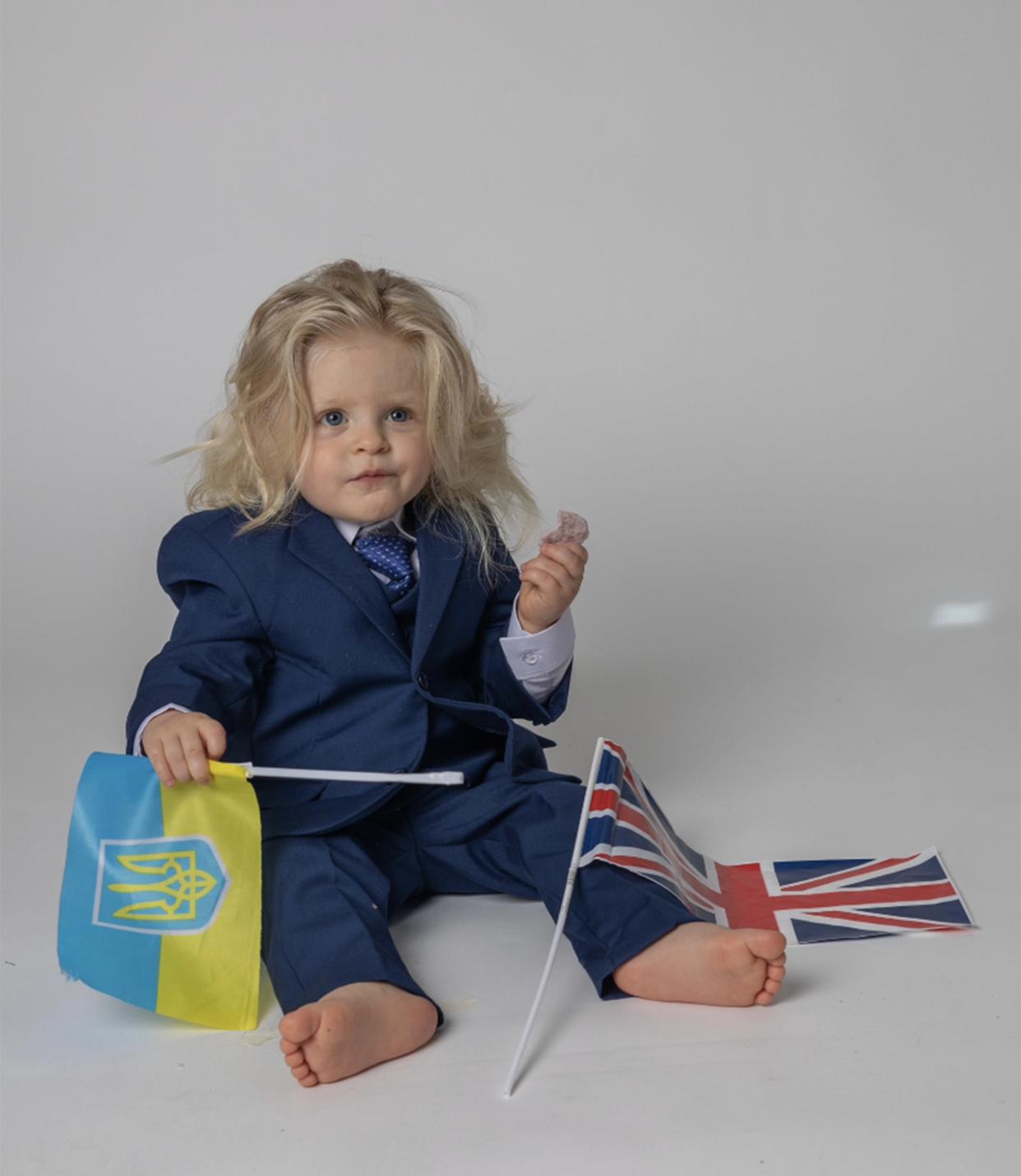 David posed with the Ukrainian and British flags in June 2022.  (Courtesy AstrellaPhotography)