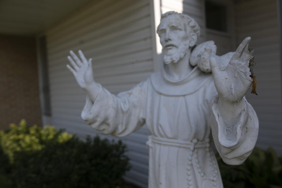 A stature of St. Francis of Assisi at the entrance of the church and school that bear his name in Greenwood, Miss., Monday, June 10, 2019. Franciscan friars have been working in Greenwood since the 1950s. (AP Photo/Wong Maye-E)