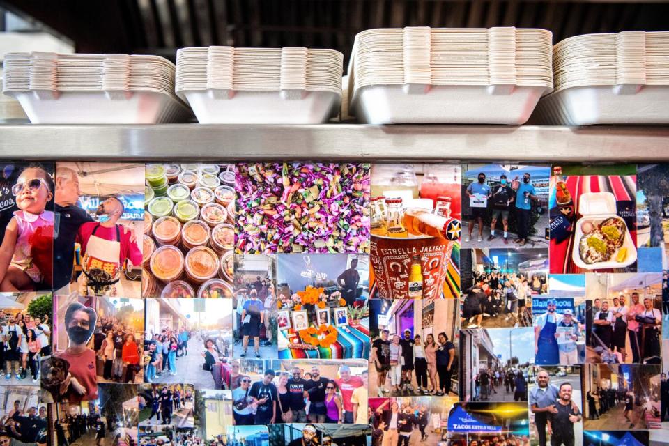 A collection of photos of staff, food and customers decorates the counter inside Villa's Tacos.