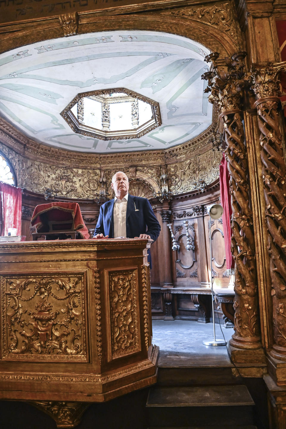 Art historian David Landau stands in the 1531-32 Canton Schola Synagogue in Venice, northern Italy, Wednesday, June 1, 2022. Landau is spearheading the fundraising effort to restore Venice's synagogues and nearby buildings both for Venice’s small Jewish community and for tourists who can visit them on a guided tour through the Jewish Museum of Venice. (AP Photo/Chris Warde-Jones)