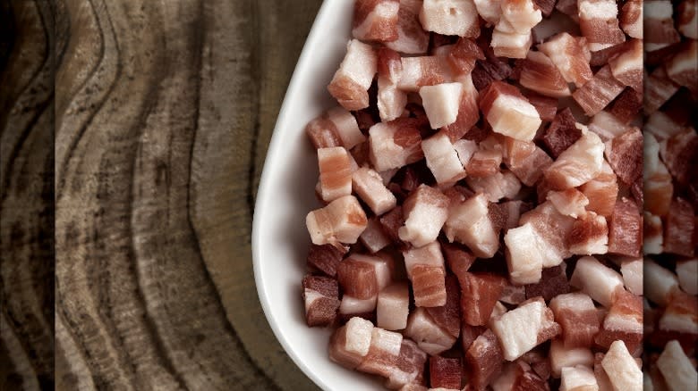 diced uncooked pancetta in dish