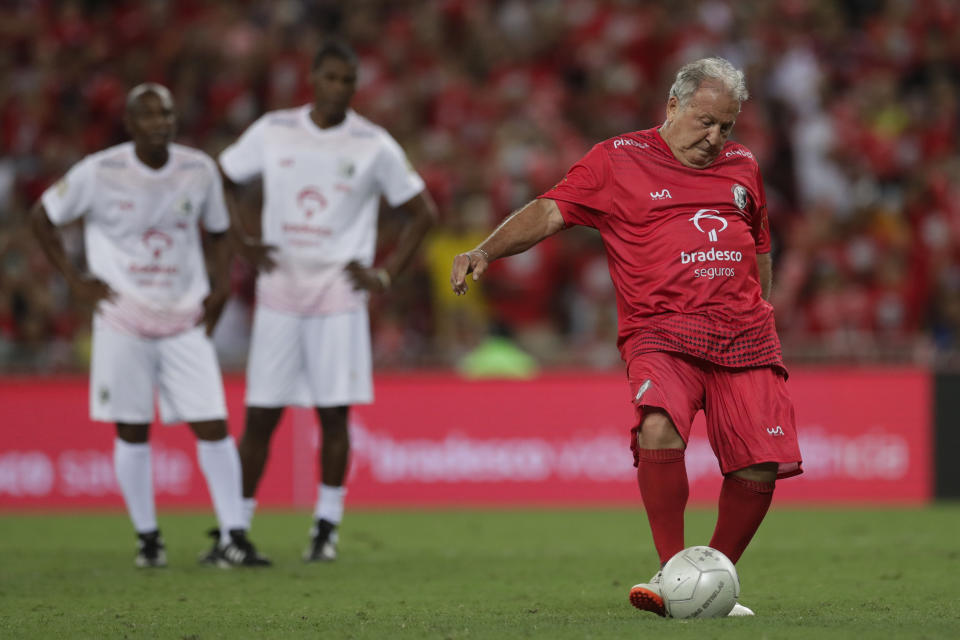 Former Brazilian soccer great Zico kicks to score a goal during a Game of the Stars charity soccer match, at the Maracana Stadium, in Rio de Janeiro, Brazil, Dec. 27, 2023. (AP Photo/Bruna Prado)