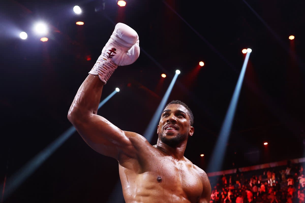 Celebration: Anthony Joshua stopped Otto Wallin after five rounds in Saudi Arabia (Getty Images)