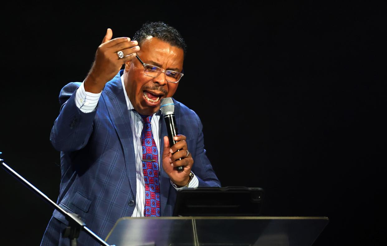 The Rev. Derrick Scobey speaks during a remembrance ceremony for Dr. Kenneth Wayne Blair, Sr., known as Santa Blair, at Life Church in Edmond, Okla. Saturday, April 6, 2024.