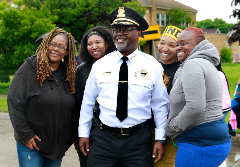 Milwaukee County Sheriff Earnell Lucas poses for a photo with paradegoers.