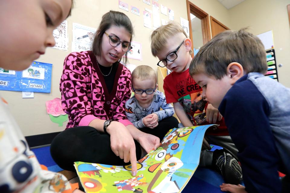 Vanessa Hanagan, an early childhood student teacher, reads to a group of children at Appletree Connections Tuesday, April 18, 2023, in Appleton, Wis. Hanagan is studying early childhood education at Fox Valley Technical College.Dan Powers/USA TODAY NETWORK-Wisconsin. 