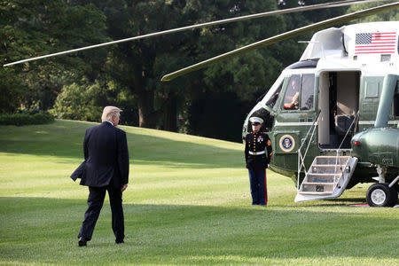 President Donald Trump crosses the South Lawn before boarding Marine One at the White House in Washington, D.C., U.S. July 22, 2017. REUTERS/Zach Gibson