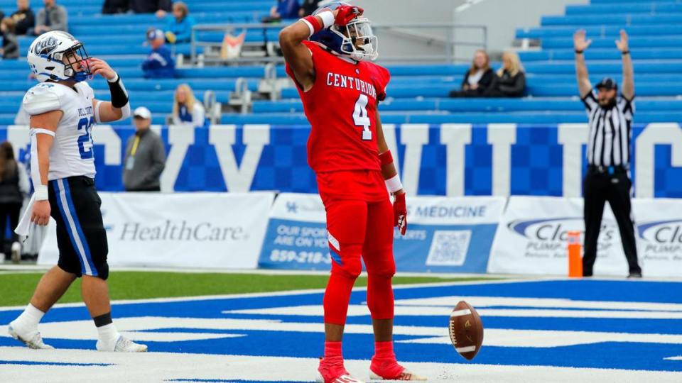 Christian Academy-Louisville’s Justin Ruffin (4) celebrates his 31-yard touchdown reception during the second half of Saturday’s Class 3A state championship game at Kroger Field in Lexington. The Centurions won the 3A title for the second year in a row.