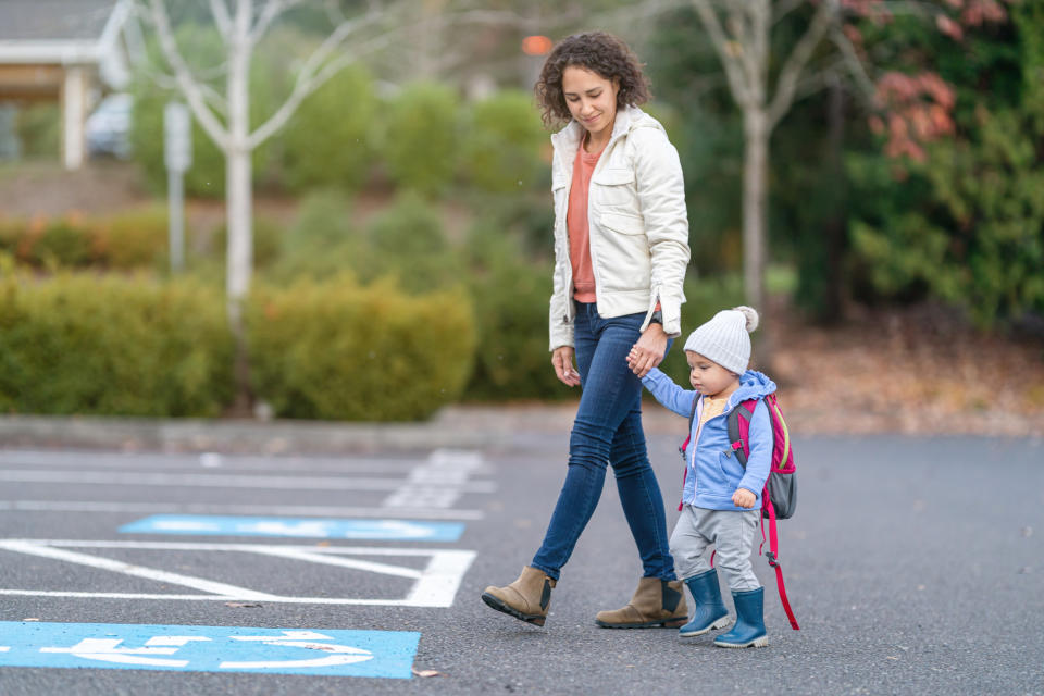 A mother and child walking down the street