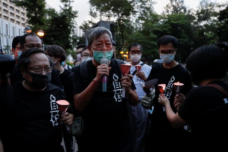 Protesters take part in a candlelight vigil to mark the 31st anniversary of the crackdown of pro-democracy protests at Beijing's Tiananmen Square in 1989, in Hong Kong