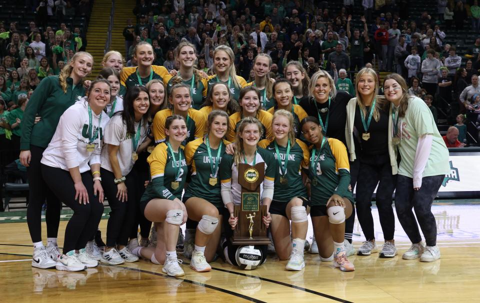 Ursuline players celebrate after defeating Magnificat, 3-1, on Nov. 12, 2022, at the Wright State Nutter Center to earn the Division I state volleyball championship.